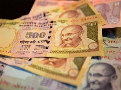 Rupee closes weaker against US dollar at 67.65 ahead of GDP data