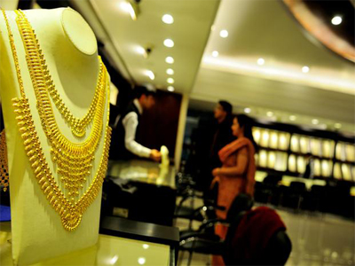 Gold slips on low demand, silver rebounds sharply