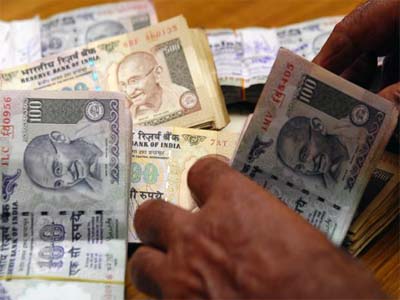 Rupee opens higher at 66.42 against US dollar