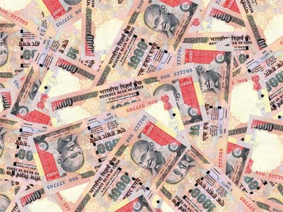 Rupee down 13 paise on strong dollar demand