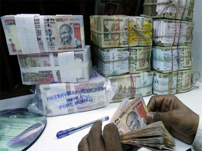 Rupee trades higher at 66.86 against US dollar