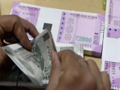 Rupee trades marginally higher against US dollar