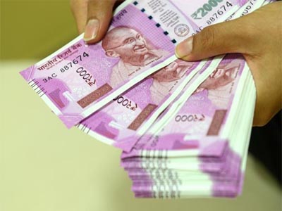 Rupee closes one-month low against US dollar ahead of Fed meet