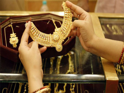 Gold at over 1-week high on global cues, seasonal demand