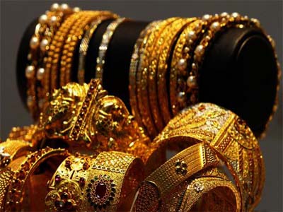 Gold drops on global cues, low demand; silver remains weak