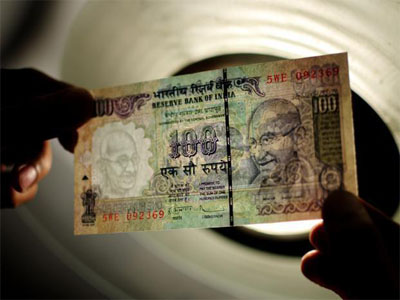 Rupee trades higher at 65.64 against US dollar 