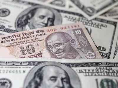 Rupee trades marginally higher against US dollar