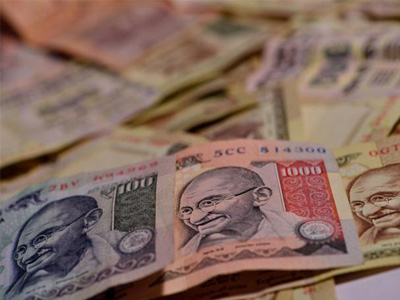 Rupee trades marginally lower at 66.69 against US dollar