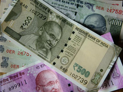 Rupee trades flat against US dollar