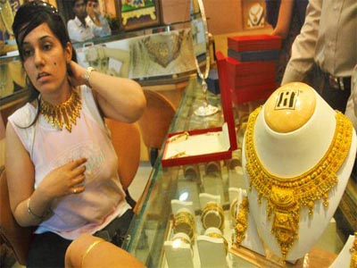 Gold, silver dim on low demand, weak global cues