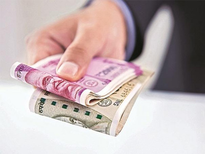 Rupee opens flat against US dollar amid muted global cues, soft oil prices